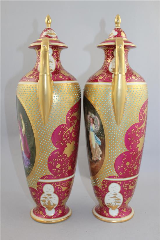 A pair of Vienna style porcelain twin handled vases and covers, c.1880-1900, 41.5cm, damages to cove